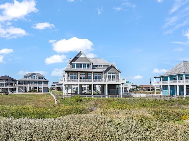 3450 Smiths Pt, Crystal Beach, TX 77650 - rear view of property featuring a balcony