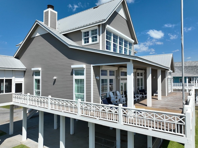 3450 Smiths Pt, Crystal Beach, TX 77650 - rear view of house featuring a wooden deck