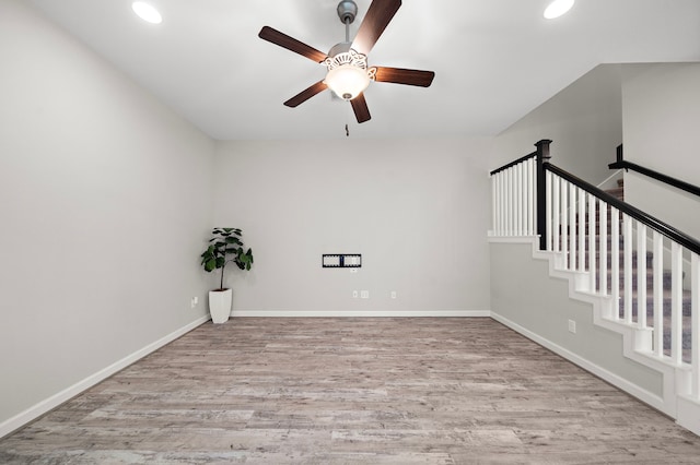 spare room featuring ceiling fan and light hardwood / wood-style flooring