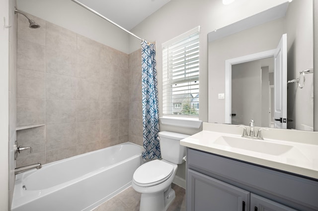 full bathroom featuring vanity, shower / tub combo, tile patterned floors, and toilet