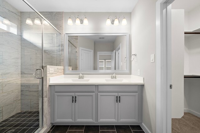 bathroom with vanity and a shower with shower door