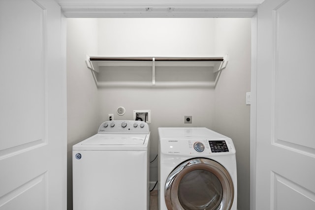 laundry room featuring washing machine and dryer