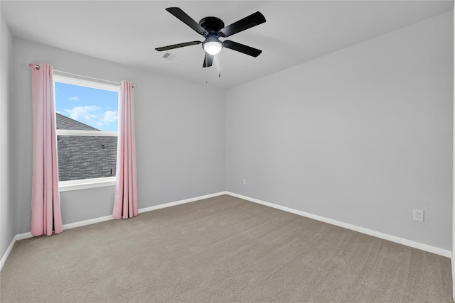 empty room with carpet floors and ceiling fan