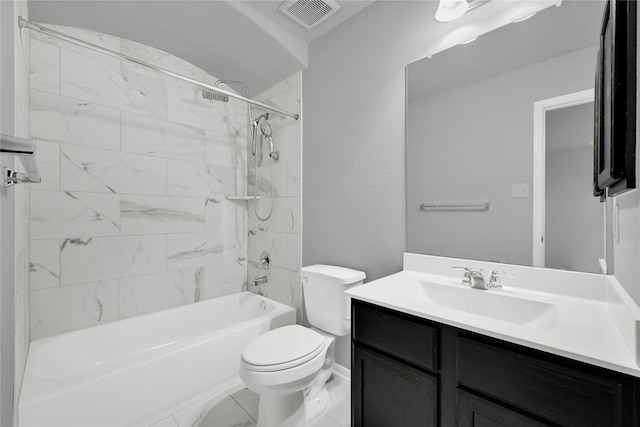 full bathroom with tiled shower / bath combo, vanity, and toilet