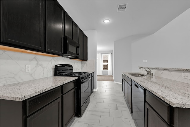 kitchen featuring tasteful backsplash, sink, and black appliances