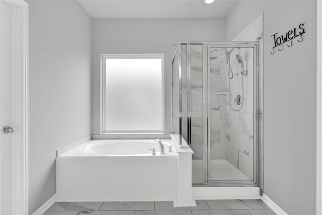 bathroom with shower with separate bathtub