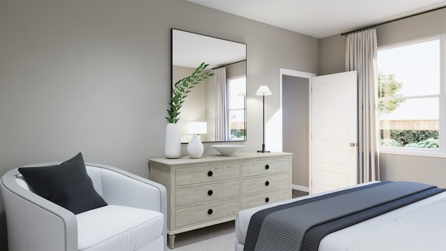 bedroom featuring multiple windows and light colored carpet