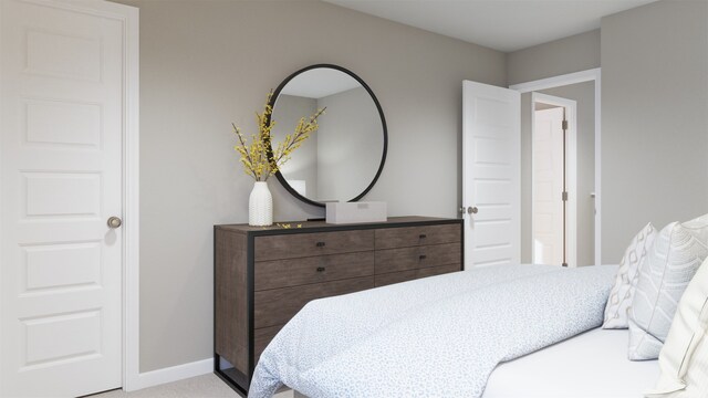 bedroom featuring light colored carpet