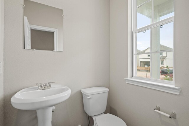 half bath featuring toilet
