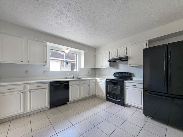 kitchen featuring white cabinetry, sink, light tile patterned floors, and black appliances