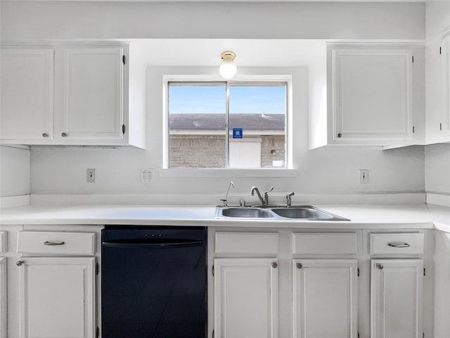 kitchen featuring white cabinetry, dishwasher, and sink