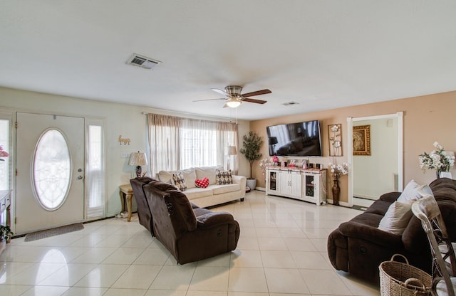 tiled living room featuring ceiling fan