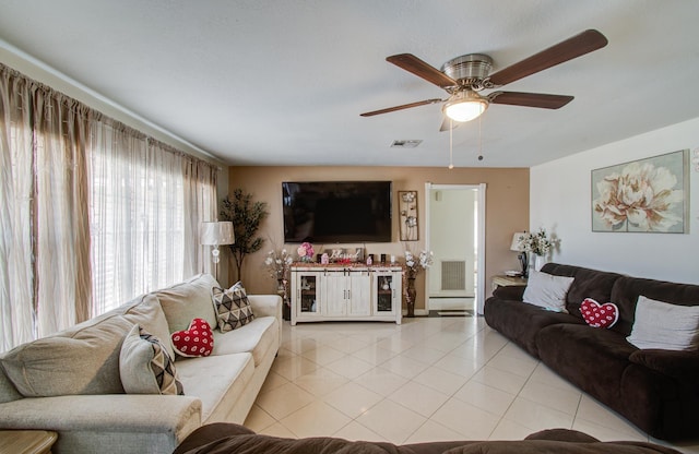 living room featuring light tile patterned floors and ceiling fan