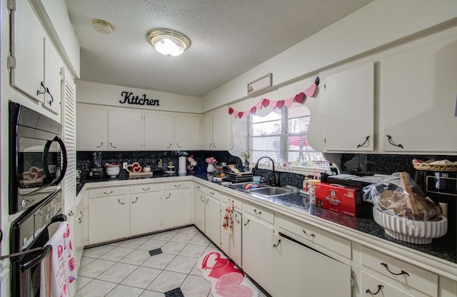 kitchen featuring tasteful backsplash, black appliances, sink, and white cabinets