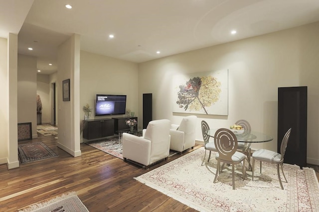 living room with dark hardwood / wood-style flooring