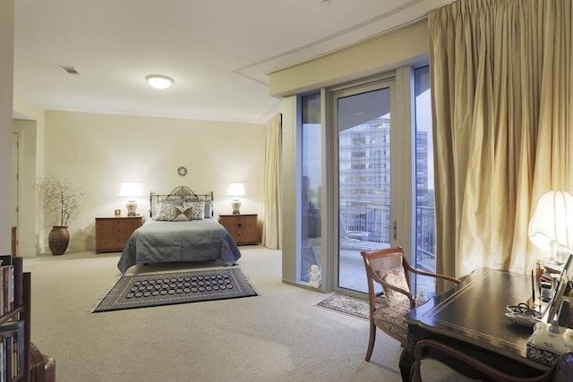 bedroom featuring crown molding, light carpet, and access to outside