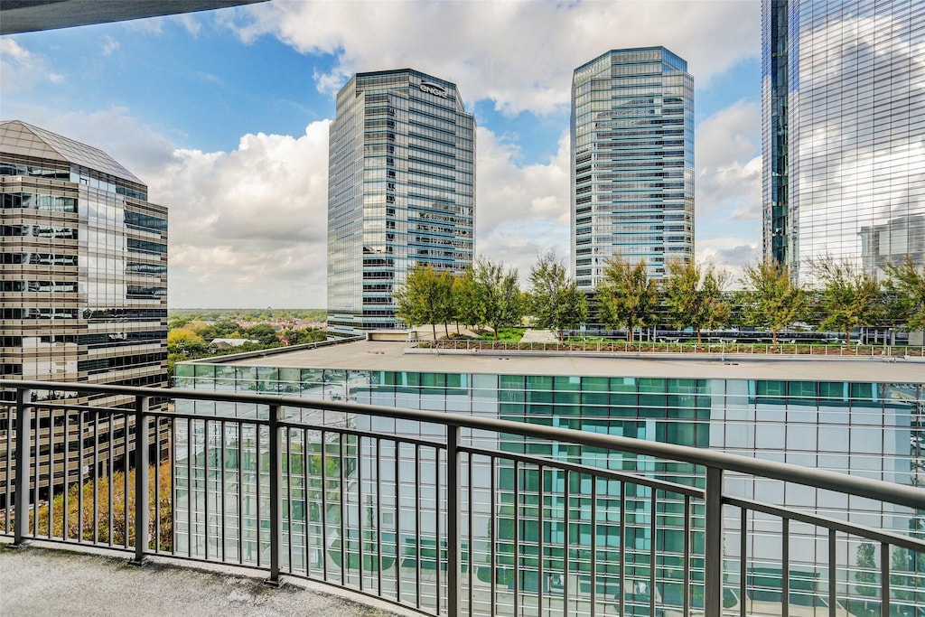 balcony with a water view and a city view