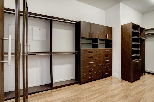 walk in closet featuring light wood-type flooring