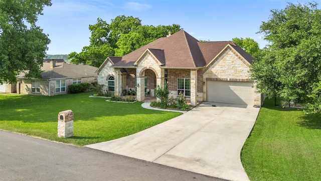 view of front of house featuring a garage and a front yard