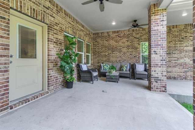 view of patio / terrace featuring ceiling fan and an outdoor living space