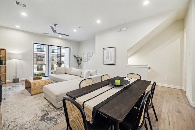 dining space featuring ceiling fan and light hardwood / wood-style floors