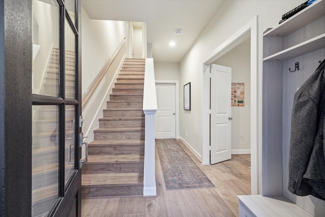 stairway featuring hardwood / wood-style floors