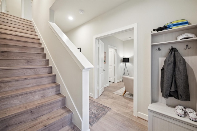 stairway featuring hardwood / wood-style flooring