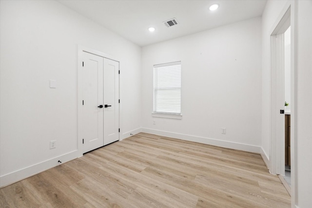 unfurnished bedroom with light hardwood / wood-style floors