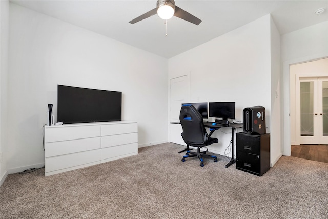 carpeted home office featuring ceiling fan and french doors