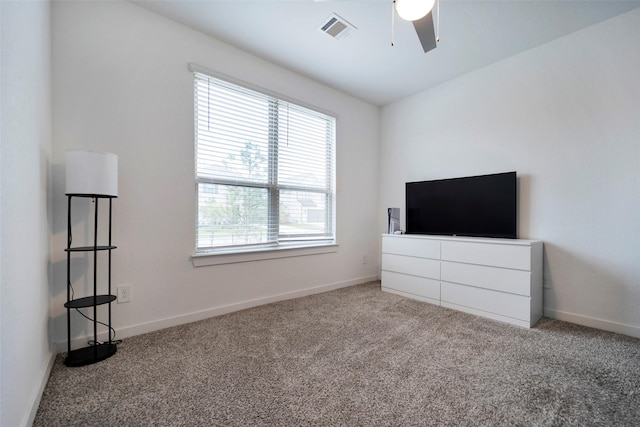 unfurnished bedroom with carpet flooring and ceiling fan