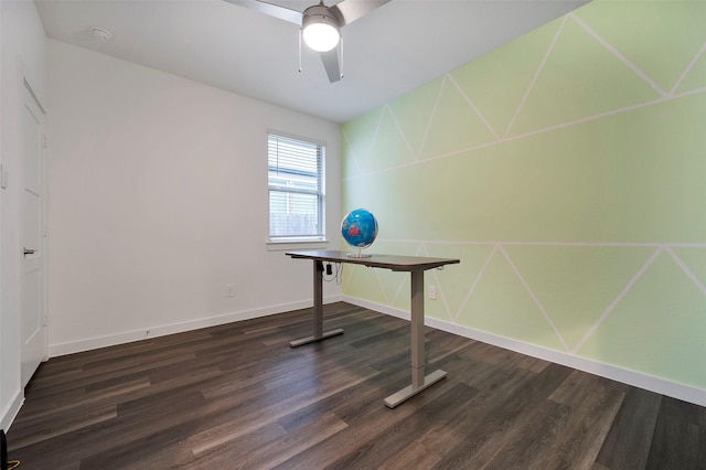 unfurnished office featuring ceiling fan and dark hardwood / wood-style flooring