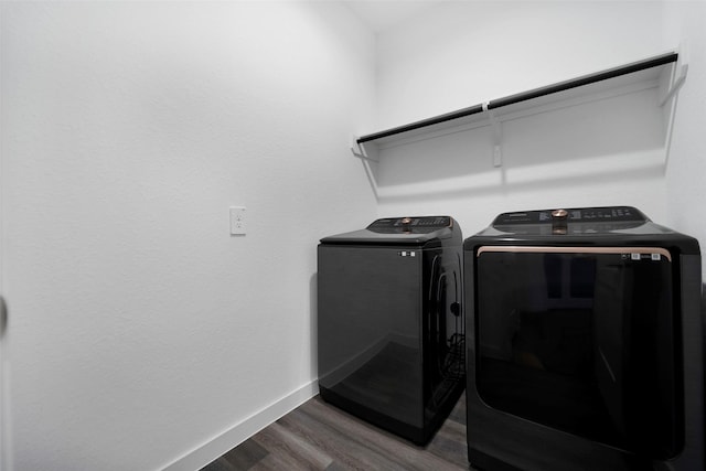 washroom featuring hardwood / wood-style floors and independent washer and dryer