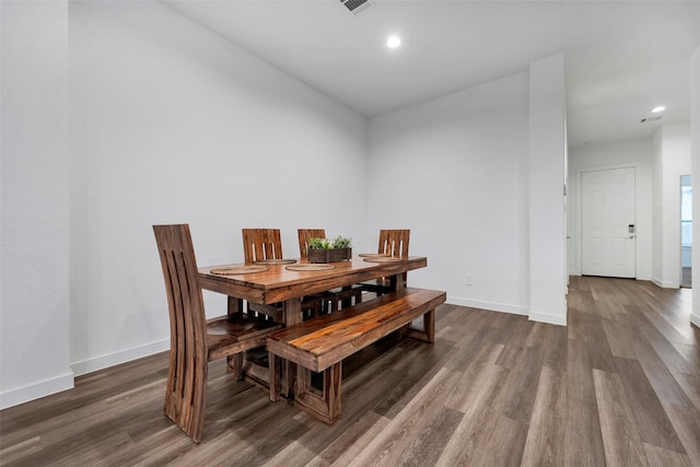 dining space featuring dark hardwood / wood-style floors