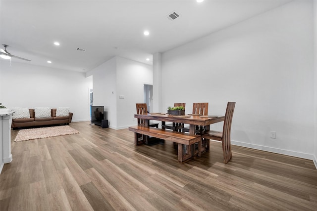 dining room featuring light hardwood / wood-style floors and ceiling fan