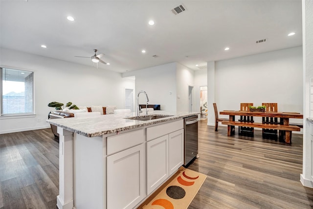 kitchen with sink, hardwood / wood-style flooring, ceiling fan, white cabinetry, and a center island with sink