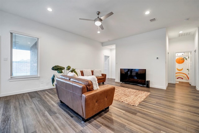 living room with hardwood / wood-style flooring and ceiling fan