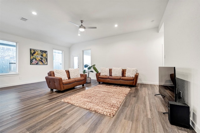 living room with ceiling fan and wood-type flooring