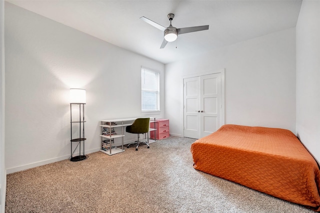 bedroom with a closet, ceiling fan, and carpet