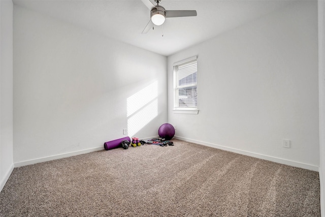 exercise area with ceiling fan and carpet flooring