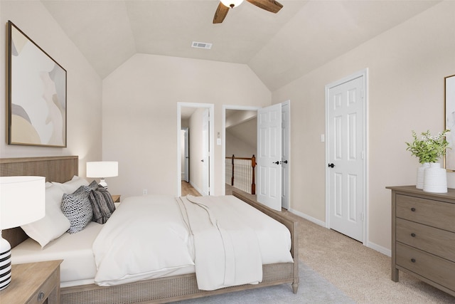 carpeted bedroom featuring lofted ceiling and ceiling fan