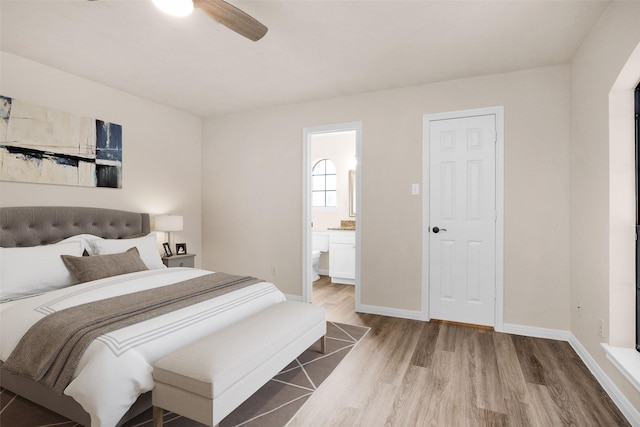 bedroom featuring wood-type flooring, connected bathroom, and ceiling fan