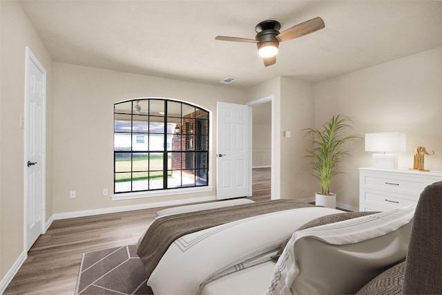 bedroom featuring ceiling fan and light wood-type flooring