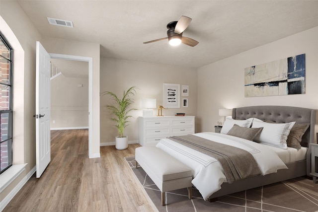 bedroom featuring ceiling fan and light hardwood / wood-style flooring