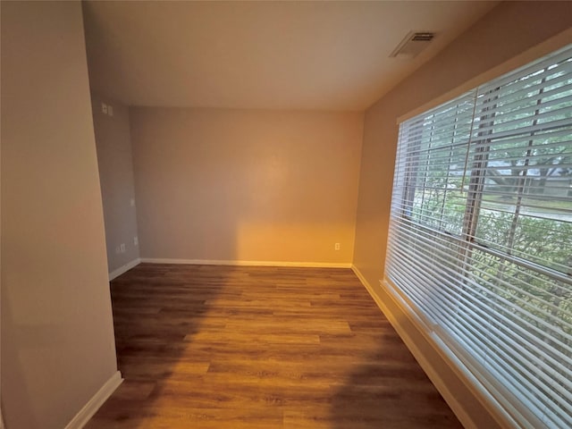 empty room with hardwood / wood-style floors