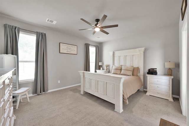 bedroom featuring ceiling fan and light carpet