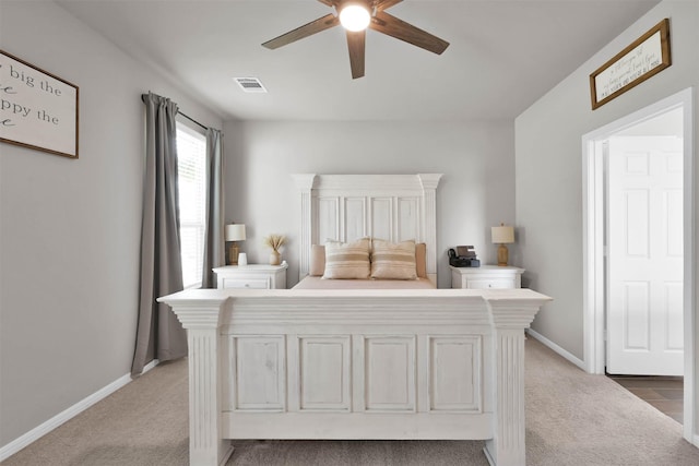 carpeted bedroom with ceiling fan