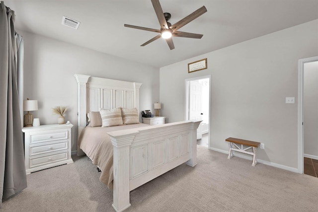 bedroom featuring ceiling fan and light colored carpet