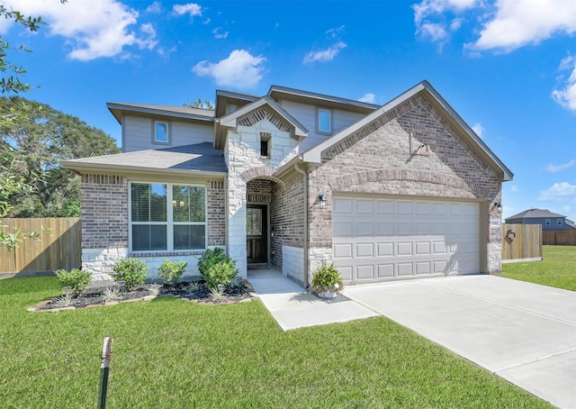 view of front of home with a garage and a front lawn