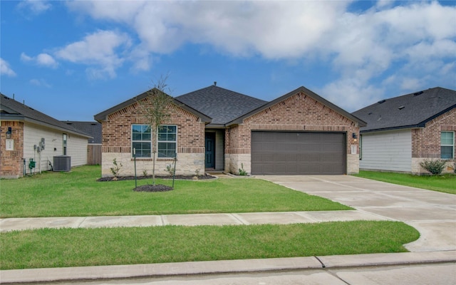 view of front of house featuring a garage, a front yard, and central air condition unit