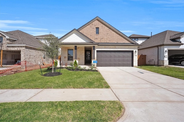 view of front facade with a garage, concrete driveway, and a front lawn